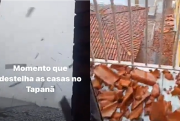 Telhas laranjas espalhadas no chão da sala de uma casa com lajotas brancas.