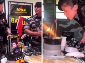 Criança de 7 anos com roupas militares comemorando aniversário e assoprando um bolo
