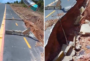 Estrada com vários buracos no meio-fio