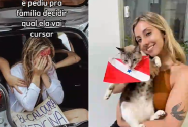 Mulher loira com um gato na colo