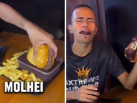Home comendo hamburguer mistura do açaí, bebida de cor escura típica do Pará