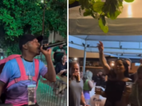 Entregador de aplicativo com mochila de entrega nas costas cantando pagode em Belém