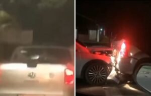 Carro prata colidindo com um carro preto