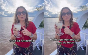 janja segurando um copo de suco