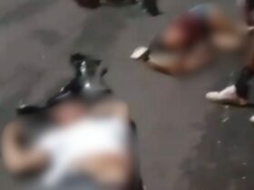 duas pessoas caídas ao chão. Imagens embaçadas devido serem fortes