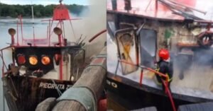 Homens do Corpo de Bombeiros atuam no combate a incêndio em embarcação.