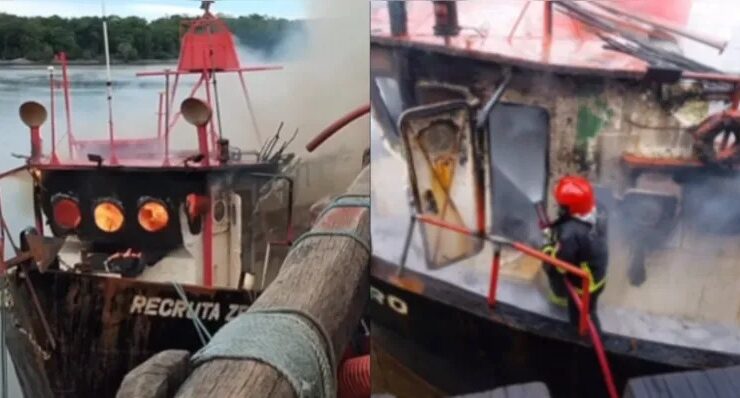 Homens do Corpo de Bombeiros atuam no combate a incêndio em embarcação.