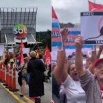 Manifestantes do MTST com placar e cartazes em frente ao SBT