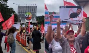 Manifestantes do MTST com placar e cartazes em frente ao SBT