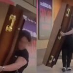 Mulher carregando caixão no cinema